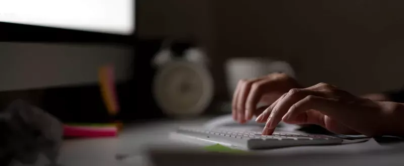 Blogging for small business: typing on keyboard.