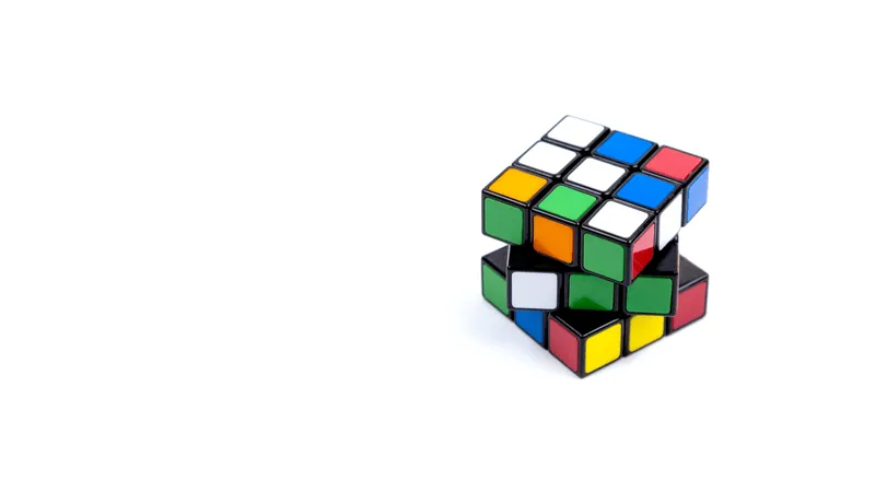 Game multi-colored cube on a white background. Game concept with copy space for text